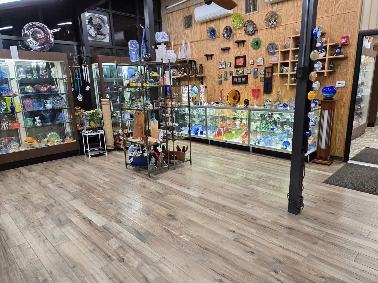The Morris Gift Gallery: glass cases and wall shelves full of colorful handmade glass