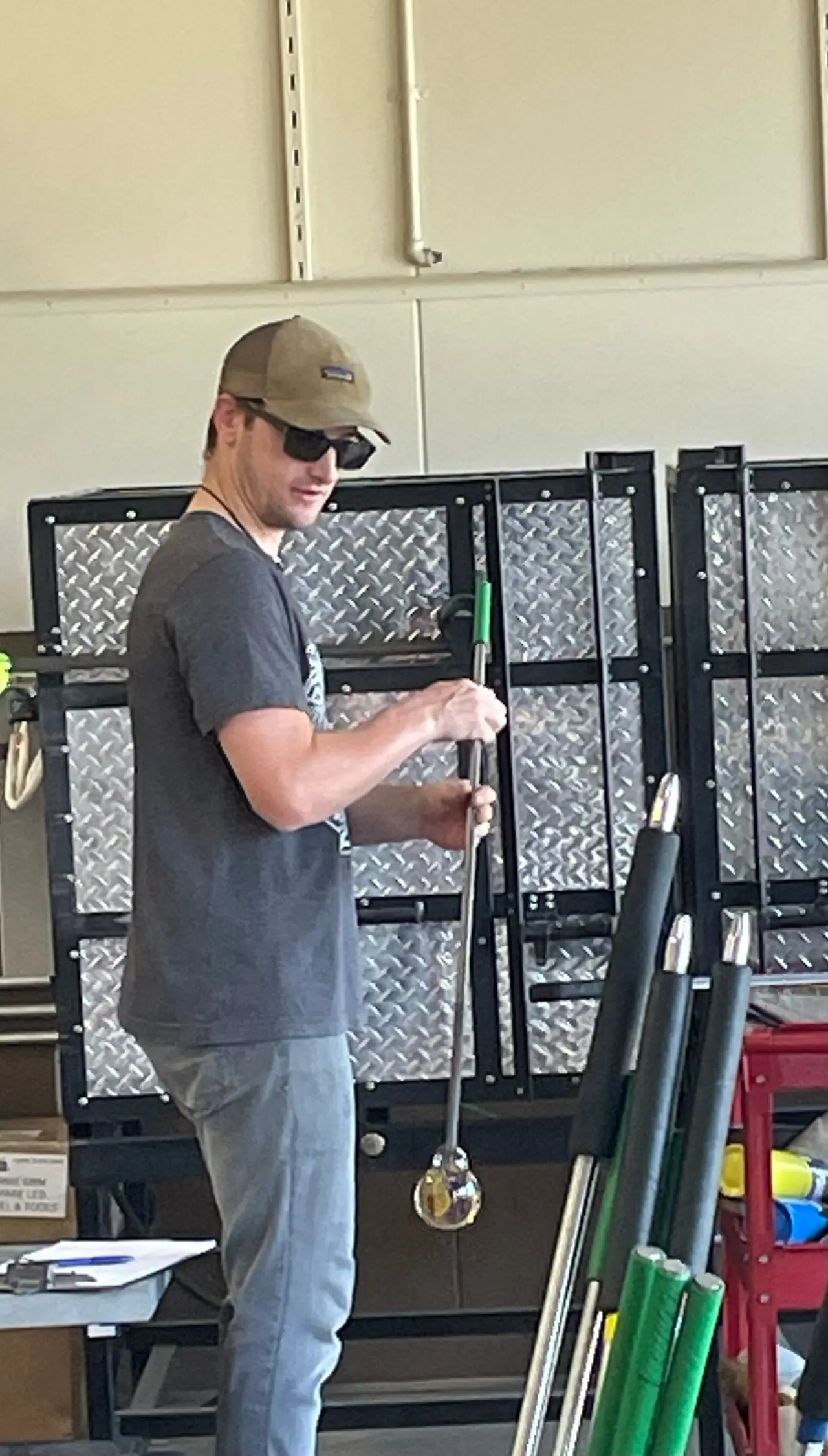 Patrick Freeman holding a blowpipe in the hot shop