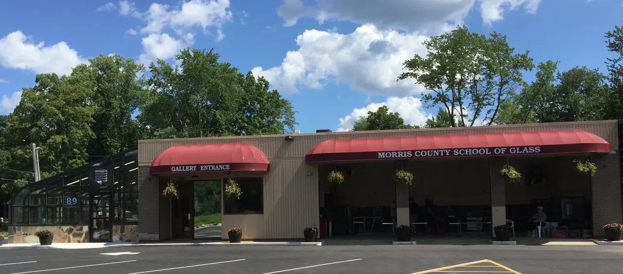The studio building on Whippany Road, with the gallery entrance under a red awning